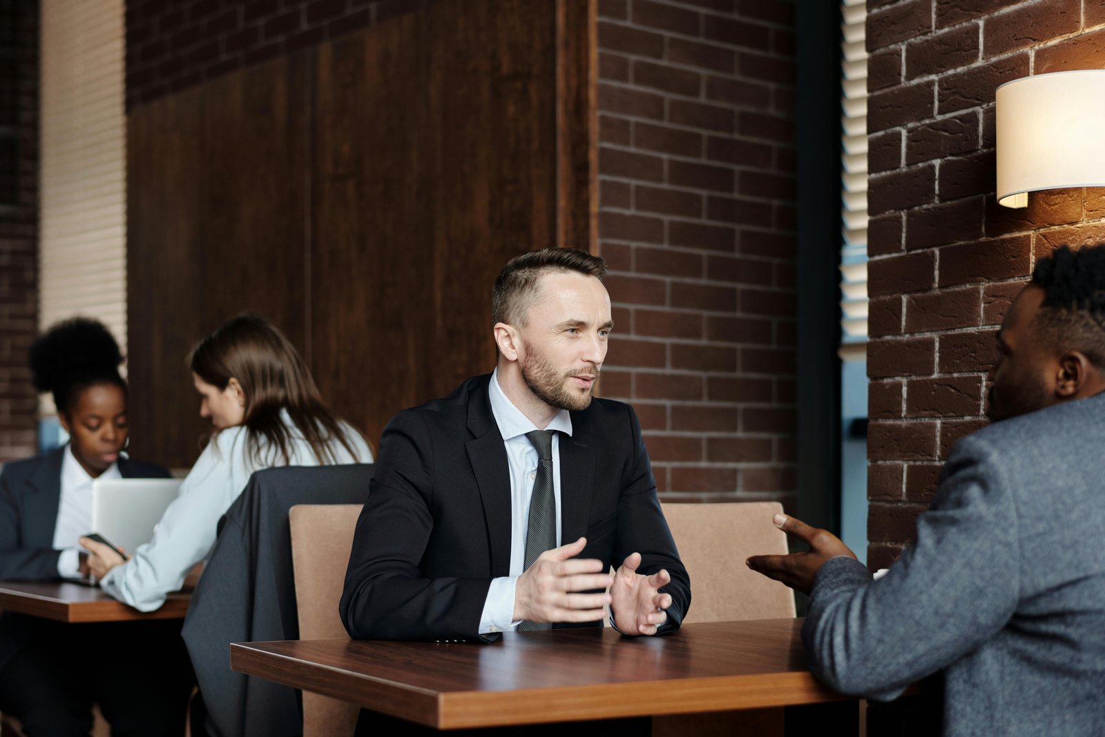Two professionals discussing the Advantages of Economic Liberty in a modern office setting.