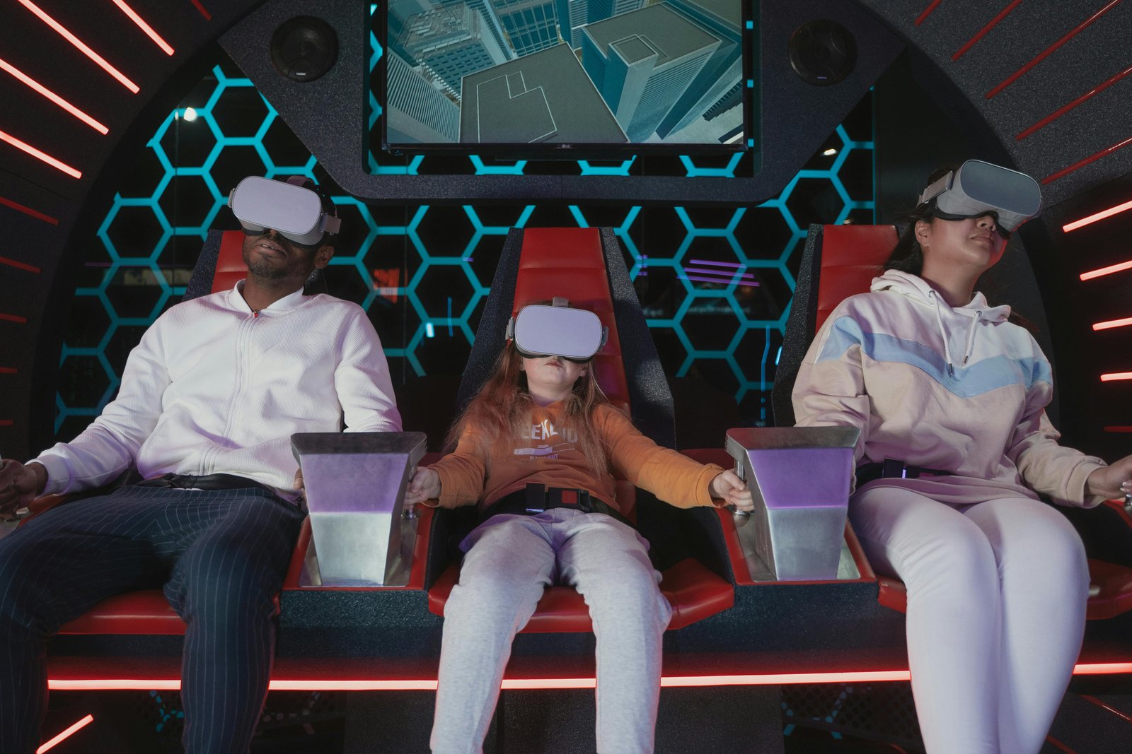 Family enjoying a virtual reality experience as part of family friendly vacation ideas.