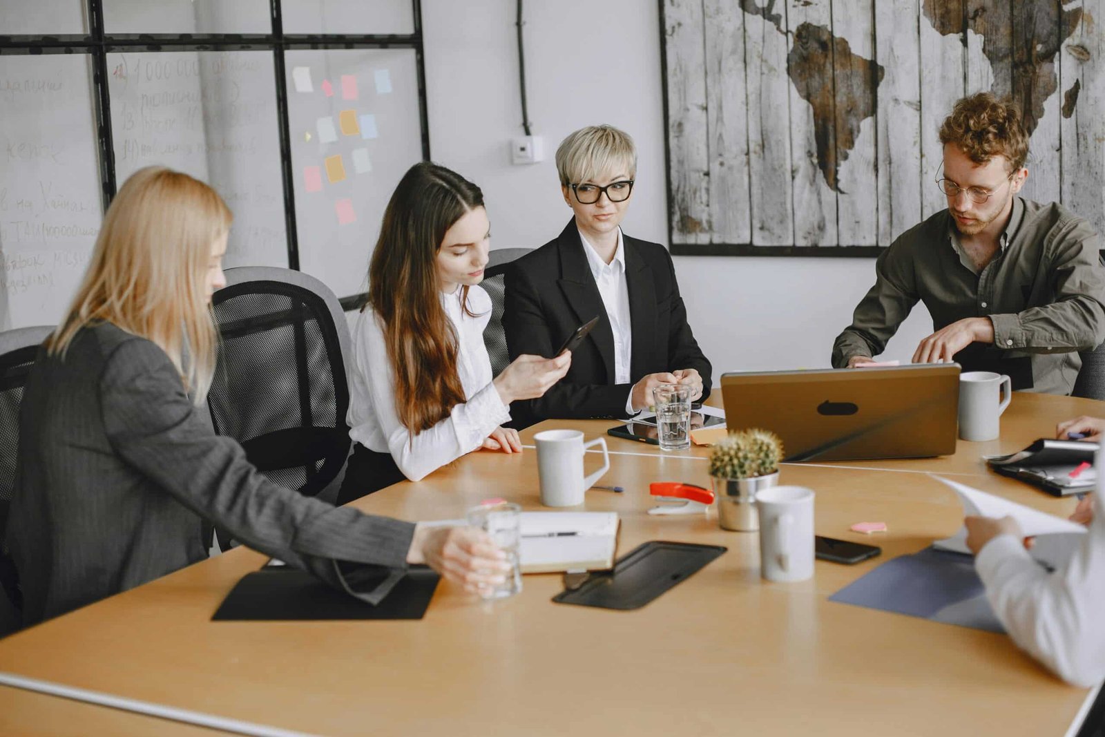 Team strategizing in a meeting room for Global Market Expansion.